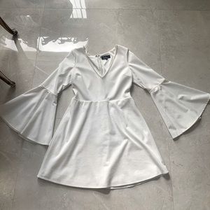 White skater dress with pearl accents